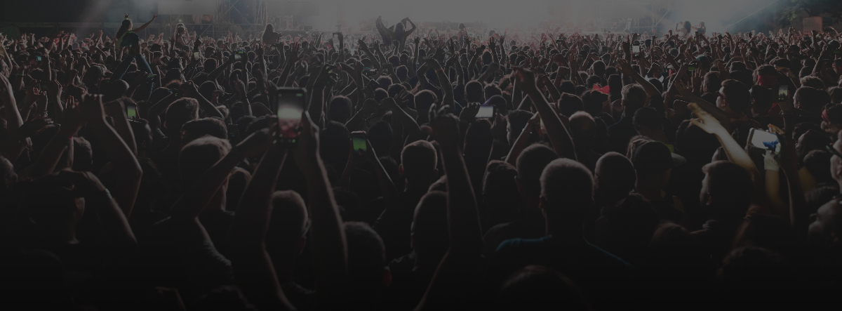 back-view-excited-audience-with-arms-raised-cheering-front-stage-music-concert-copy-space_2026-02-11-03-23-42.jpg